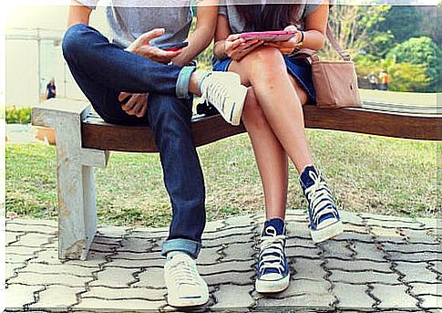 Couple with mobile phones.