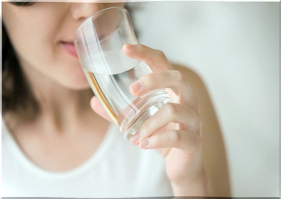 Woman drinking water.