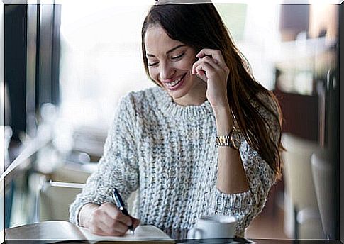 Happy woman talking on the phone