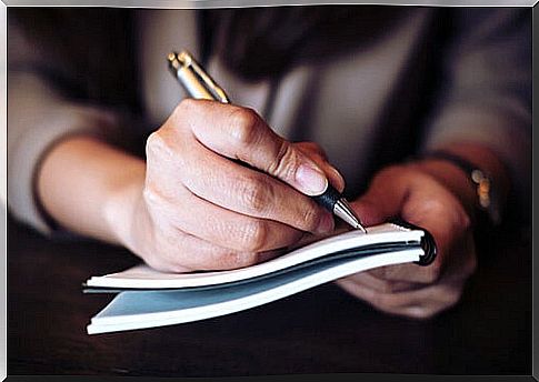 Woman writing in a notebook