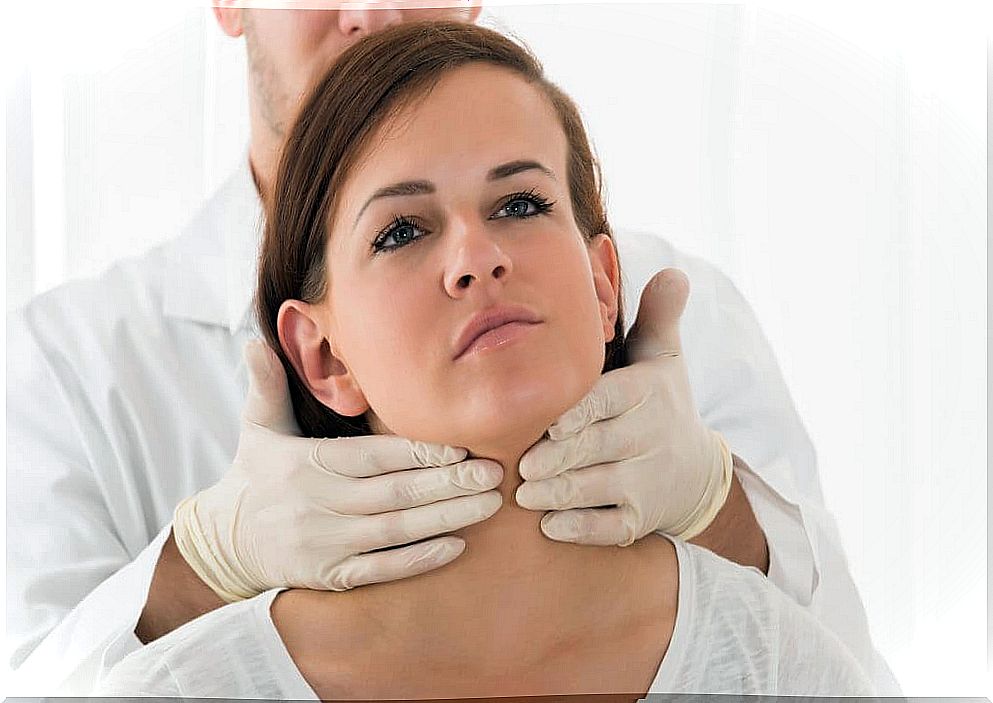 Doctor listening to a woman's thyroid