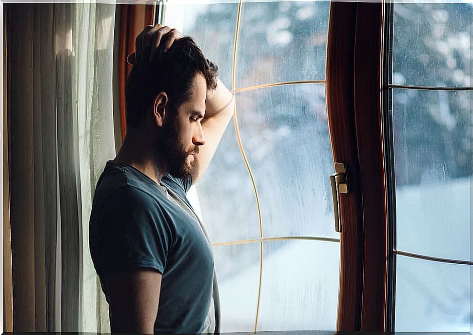 Sad man at the window