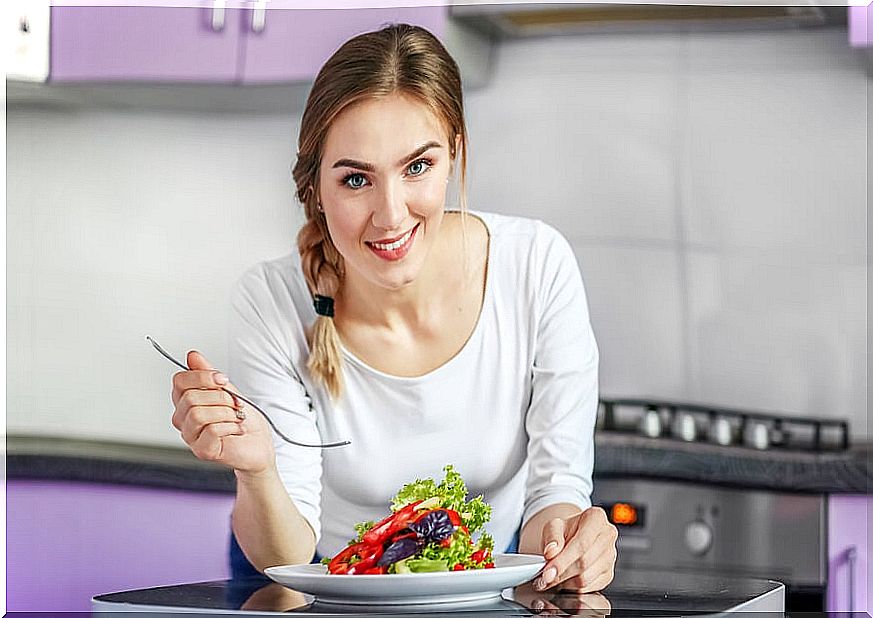 Woman eating healthy plate